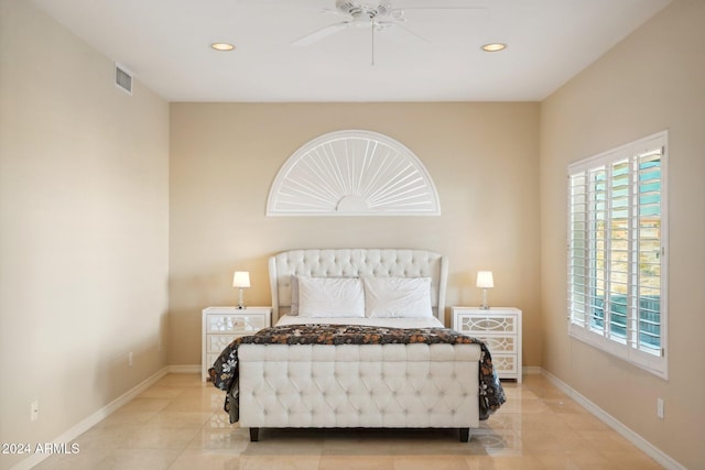 tiled bedroom with ceiling fan