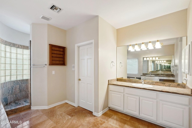 bathroom featuring vanity and walk in shower