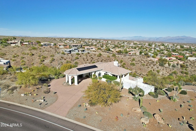 birds eye view of property with a mountain view