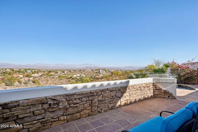 view of patio / terrace featuring a mountain view