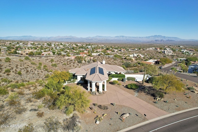 birds eye view of property with a mountain view