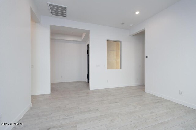 unfurnished room featuring light hardwood / wood-style floors