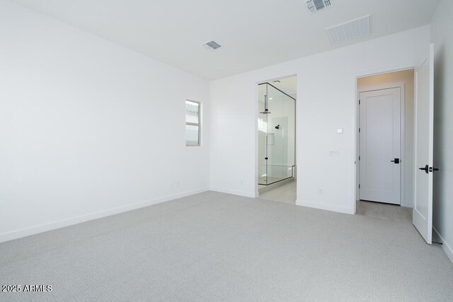 unfurnished bedroom with light colored carpet