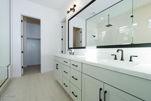 bathroom with vanity and walk in shower