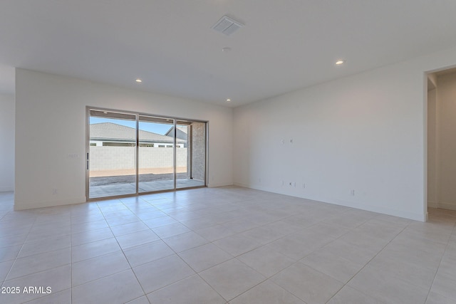 unfurnished room with light tile patterned floors