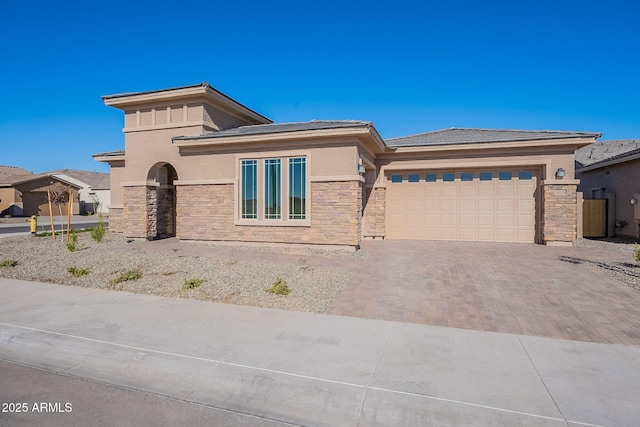 prairie-style home featuring a garage