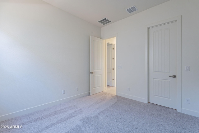 unfurnished bedroom with light colored carpet