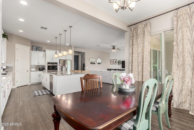 10542 W Electra Ln, Peoria, AZ 85383 - dining area featuring wood finished floors, recessed lighting, ceiling fan, and a chandelier