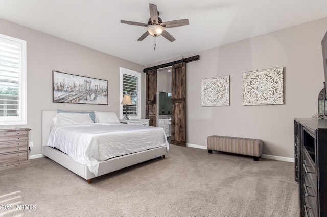 10542 W Electra Ln, Peoria, AZ 85383 - carpeted bedroom featuring a barn door, baseboards, and a ceiling fan