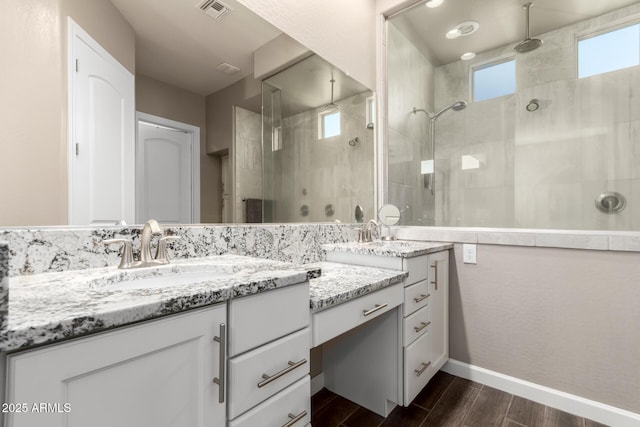 10542 W Electra Ln, Peoria, AZ 85383 - full bath featuring wood finished floors, vanity, a shower stall, and baseboards