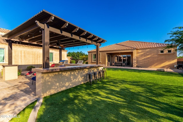 10542 W Electra Ln, Peoria, AZ 85383 - view of patio featuring a bar, a ceiling fan, and grilling area
