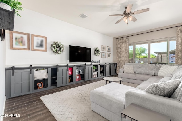 10542 W Electra Ln, Peoria, AZ 85383 - living area with dark wood-style flooring and ceiling fan