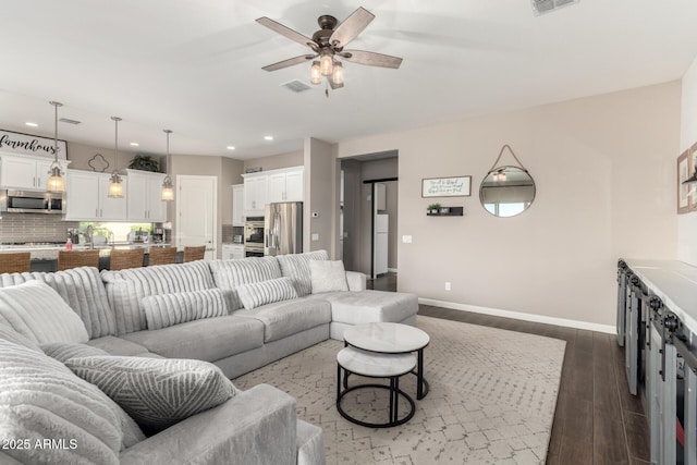 10542 W Electra Ln, Peoria, AZ 85383 - living area featuring baseboards, ceiling fan, dark wood-style flooring, and recessed lighting