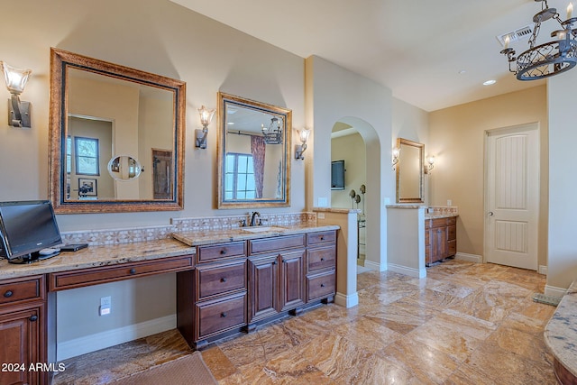 bathroom with vanity and backsplash