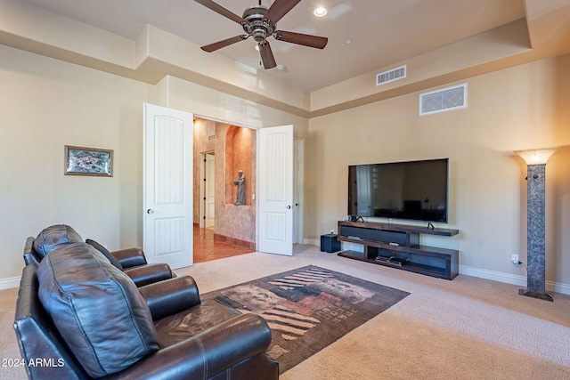 living room featuring light carpet and ceiling fan