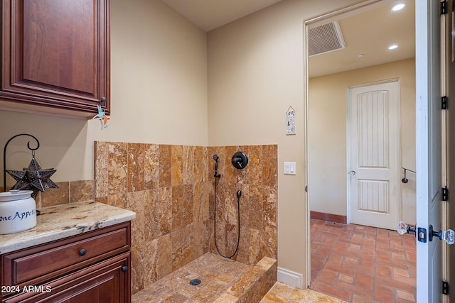 bathroom featuring vanity and walk in shower