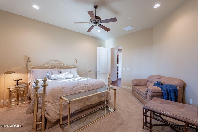 bedroom with ceiling fan and light colored carpet