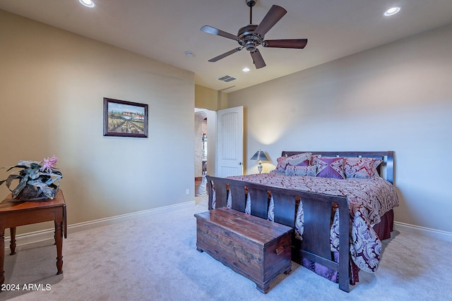 bedroom featuring light carpet and ceiling fan