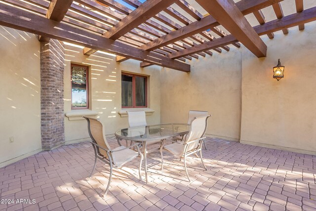 view of patio featuring a pergola