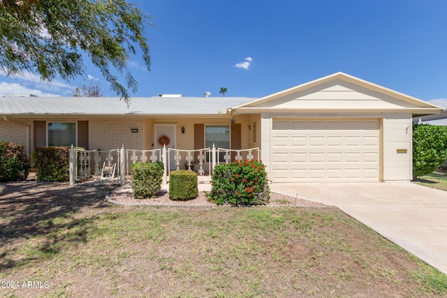 ranch-style home with a garage