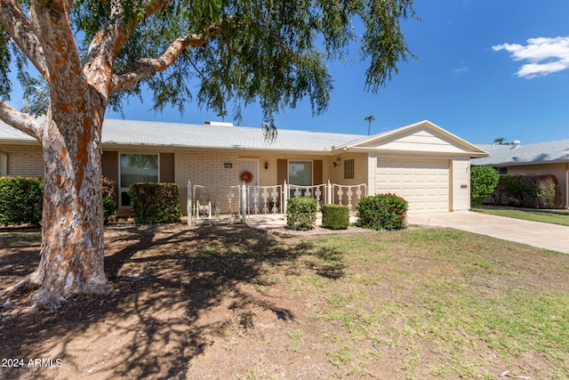 ranch-style house featuring a garage