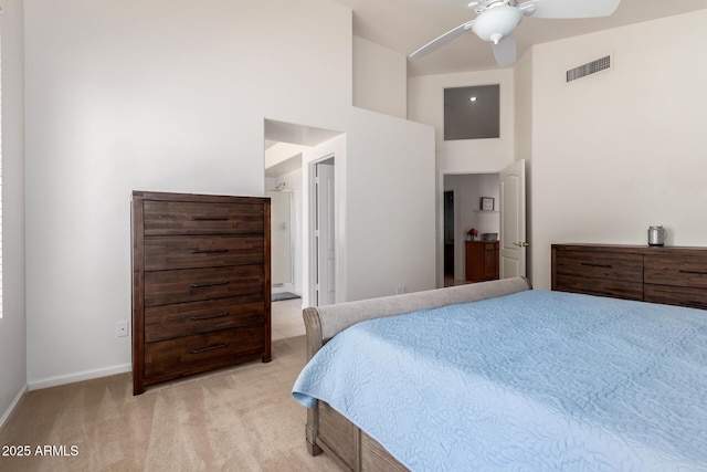 7231 W Lone Cactus Dr, Glendale, AZ 85308 - bedroom with light carpet, baseboards, a high ceiling, and a ceiling fan