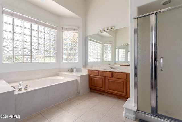 7231 W Lone Cactus Dr, Glendale, AZ 85308 - full bathroom with a garden tub, a shower stall, vanity, and tile patterned floors