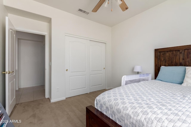7231 W Lone Cactus Dr, Glendale, AZ 85308 - bedroom with light colored carpet, a closet, a ceiling fan, and baseboards