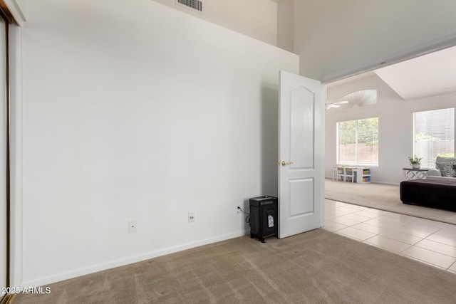 7231 W Lone Cactus Dr, Glendale, AZ 85308 - tiled spare room with carpet flooring and baseboards