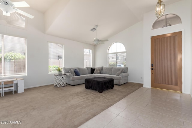 7231 W Lone Cactus Dr, Glendale, AZ 85308 - living room featuring ceiling fan, high vaulted ceiling, light carpet, baseboards, and light tile patterned flooring