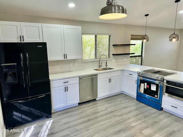 2138 E Williams Dr, Phoenix, AZ 85024 - kitchen with stainless steel appliances, a sink, white cabinetry, decorative backsplash, and recessed lighting
