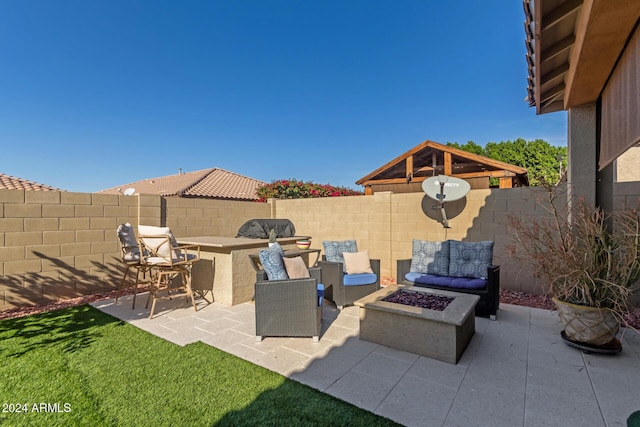 view of patio featuring an outdoor living space with a fire pit