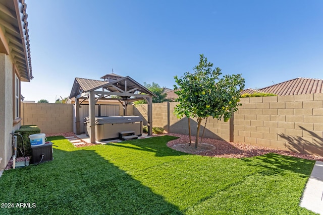 view of yard with a gazebo and a hot tub