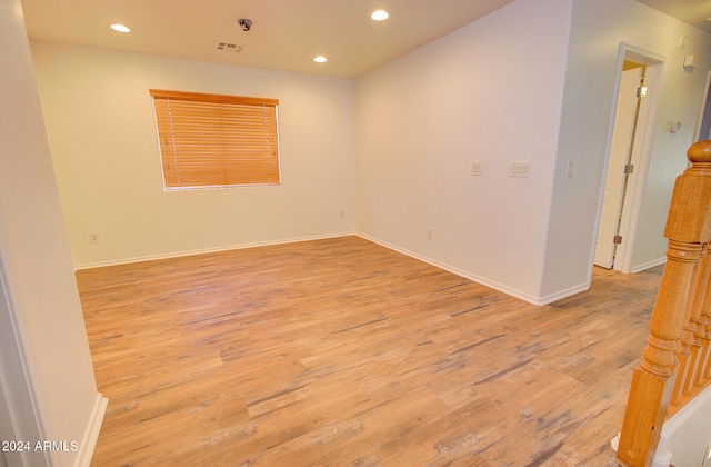 empty room with light hardwood / wood-style floors