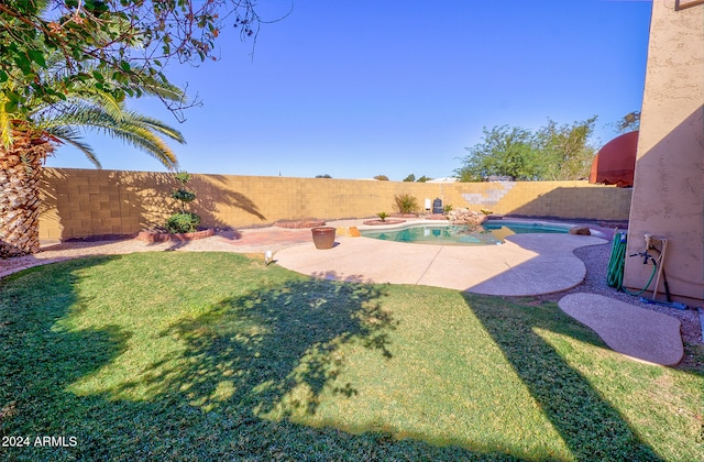 view of yard with a patio area and a fenced in pool