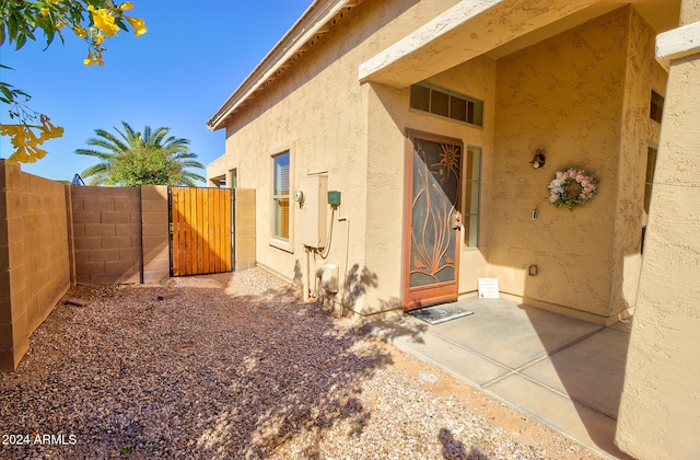 entrance to property with a patio