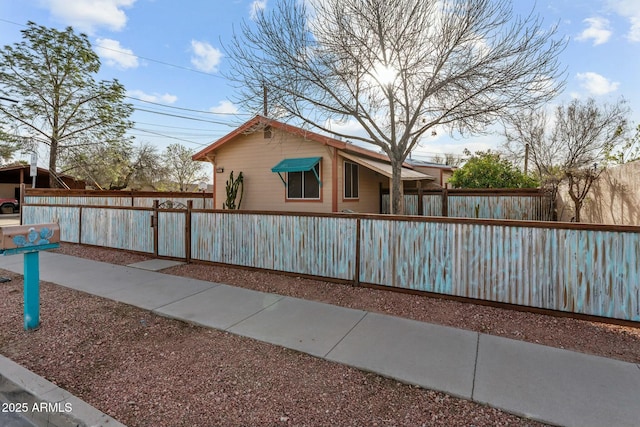 view of side of home featuring fence private yard