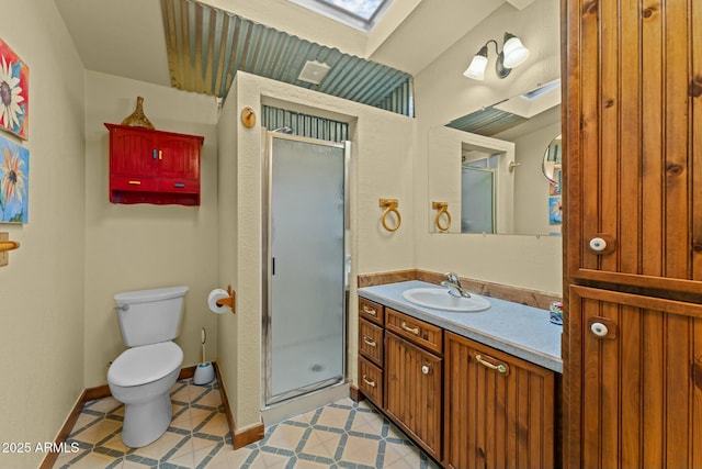 full bath with a skylight, a stall shower, toilet, tile patterned floors, and vanity