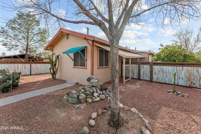 exterior space featuring a fenced backyard