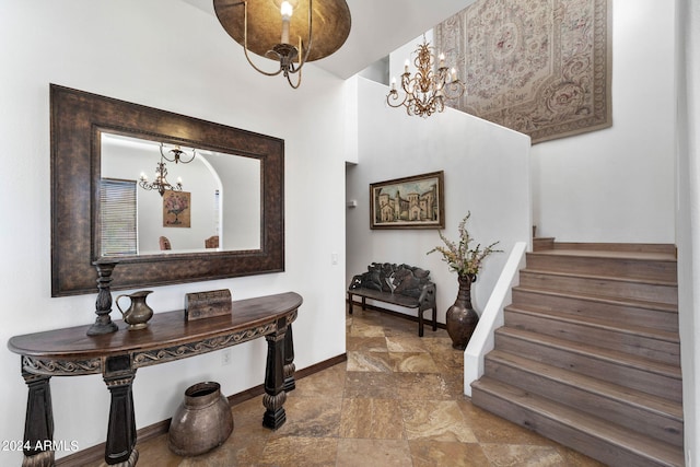 entryway with a chandelier