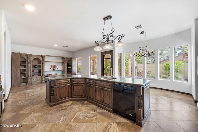 kitchen with a center island with sink, hanging light fixtures, sink, dark brown cabinets, and dishwasher