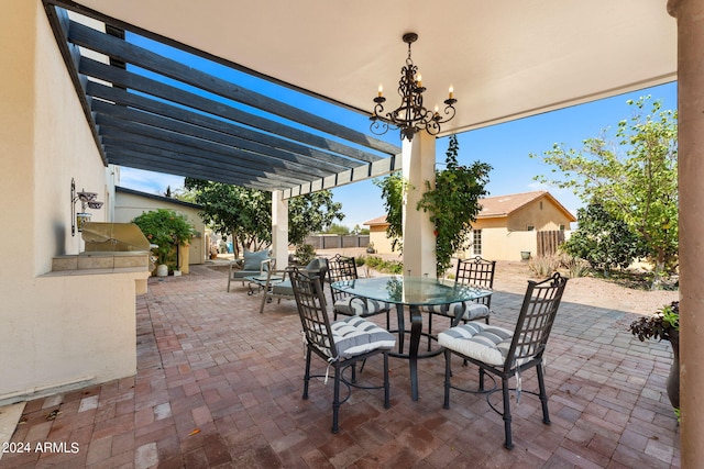 view of patio with an outdoor kitchen and a pergola