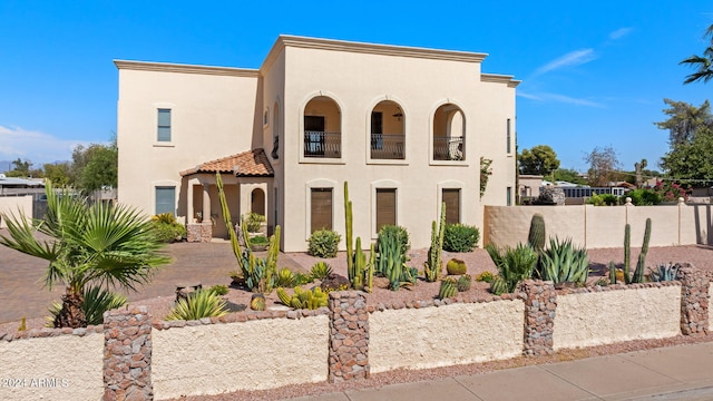 view of front of house with a balcony