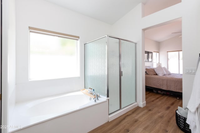9791 N 118th Way, Scottsdale, AZ 85259 - ensuite bathroom featuring a stall shower, a bath, wood finished floors, ceiling fan, and vaulted ceiling