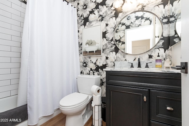 9791 N 118th Way, Scottsdale, AZ 85259 - full bathroom featuring vanity, wallpapered walls, wood finished floors, and shower / bath combo with shower curtain