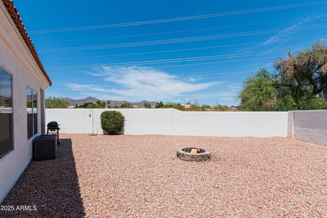 9791 N 118th Way, Scottsdale, AZ 85259 - fenced backyard with a mountain view and a fire pit