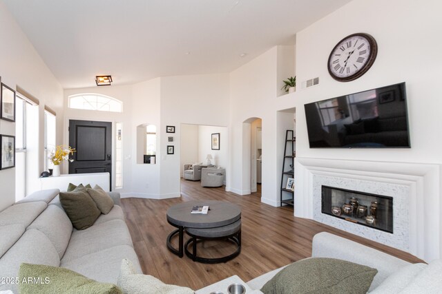 9791 N 118th Way, Scottsdale, AZ 85259 - living area with arched walkways, wood finished floors, and high vaulted ceiling