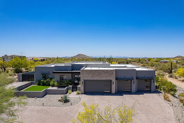 33766 N 86th St, Scottsdale, AZ 85266 - view of front of home featuring stucco siding, decorative driveway, a mountain view, and an attached garage