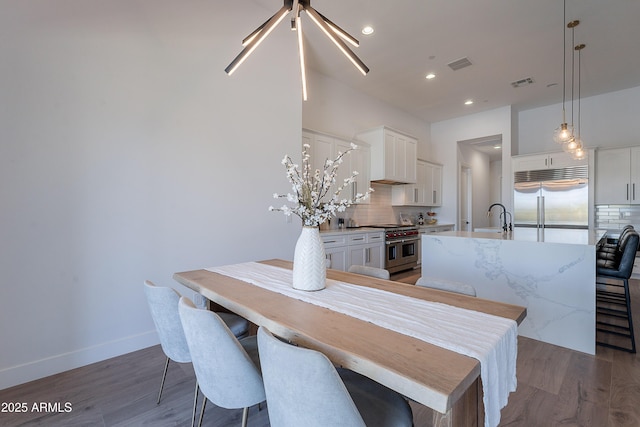 33766 N 86th St, Scottsdale, AZ 85266 - dining area with dark wood-style flooring, recessed lighting, and baseboards