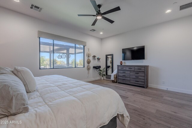 33766 N 86th St, Scottsdale, AZ 85266 - bedroom featuring baseboards, wood finished floors, recessed lighting, and ceiling fan